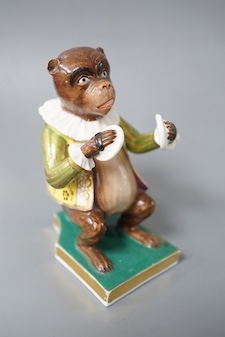 A Derby rare figure from a bear band, c.1820, wearing a green, gold and yellow jacket playing the cymbals, seated on the base, crossed swords mark in blue 10cm